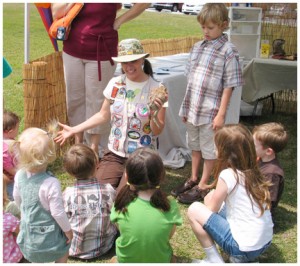 Nonie Maines teaching children about frogs. Lori Ceier/WaltonOutdoors.com
