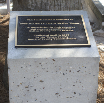 A plaque commemorates Linda McGee Wright and Cube McGee at the Live Oak beach access.